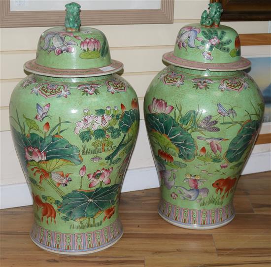 A pair of large Chinese famille rose jars and covers
